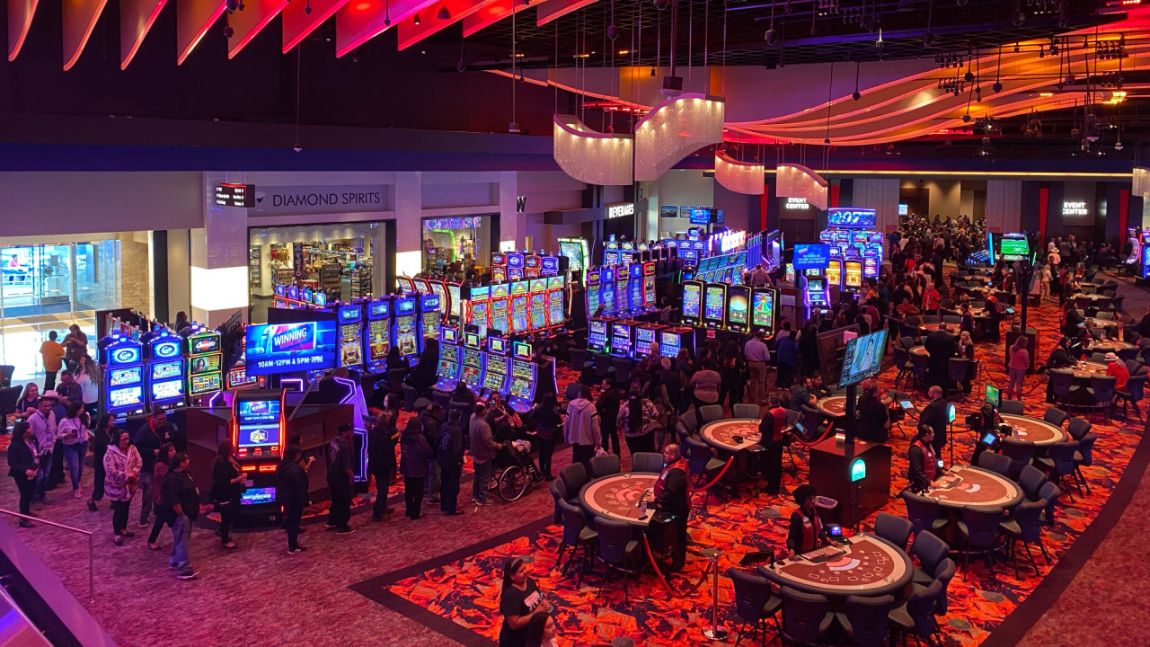 West Valley’s gaming tables and slot machines beneath warm red and orange ceiling lights